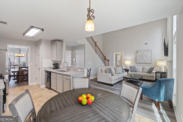 tiled dining space featuring sink