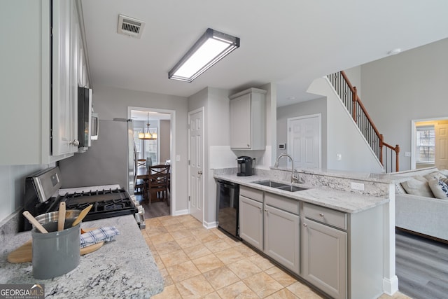 kitchen featuring stainless steel appliances, kitchen peninsula, sink, and gray cabinetry