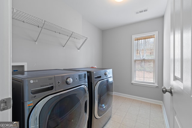 laundry room featuring washer and clothes dryer