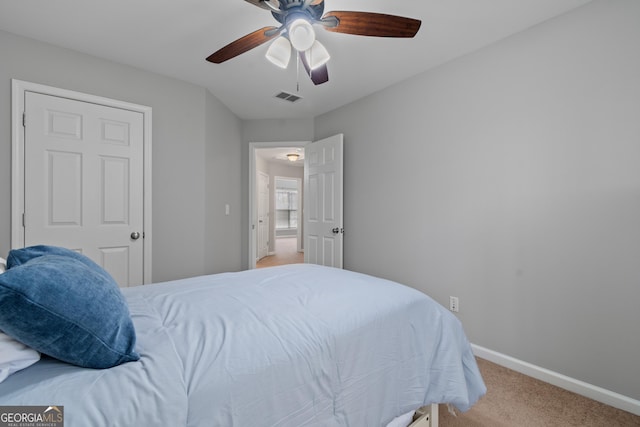 carpeted bedroom featuring ceiling fan