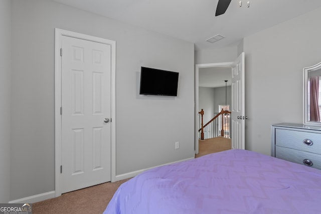 bedroom with ceiling fan and carpet