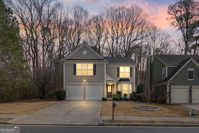 front facade with a garage