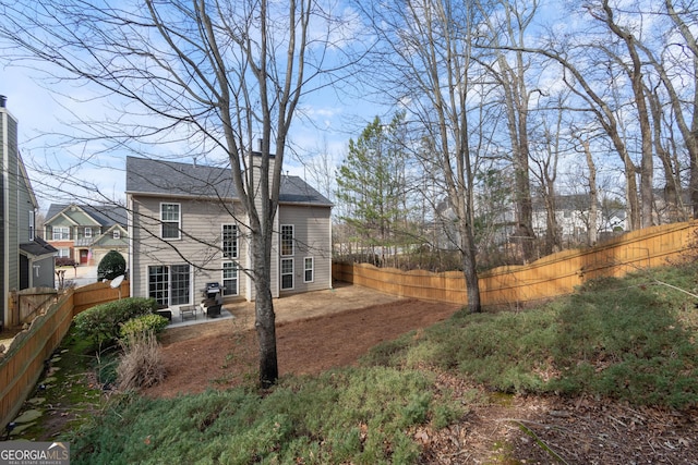 rear view of property featuring a patio area