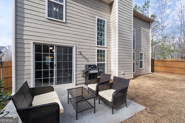 back of property featuring a patio and outdoor lounge area