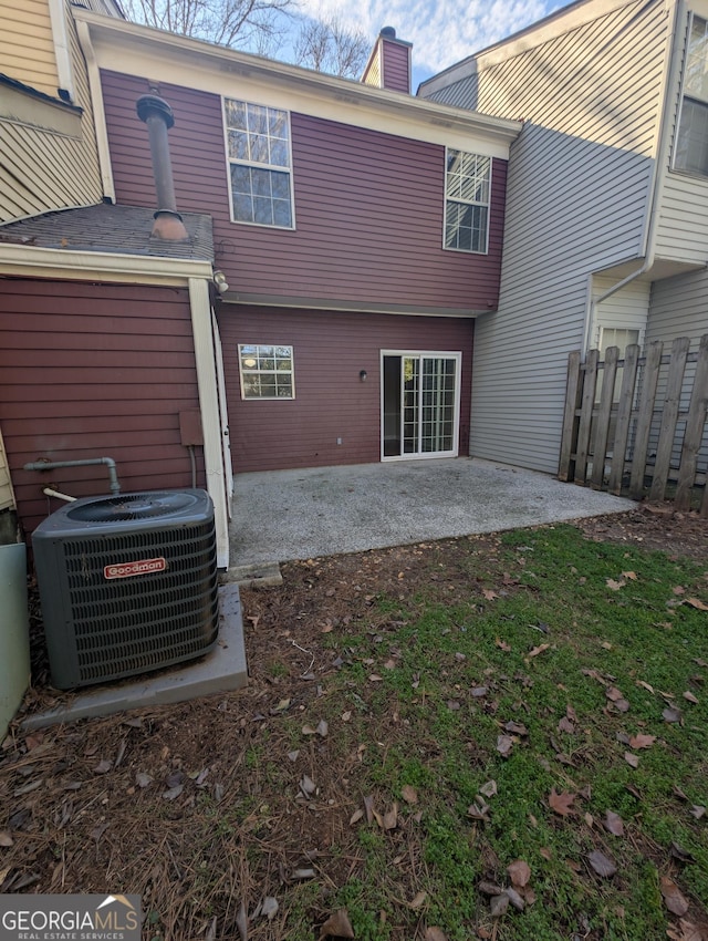 back of property featuring central AC and a patio area