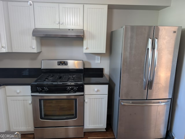 kitchen with stainless steel appliances and white cabinetry