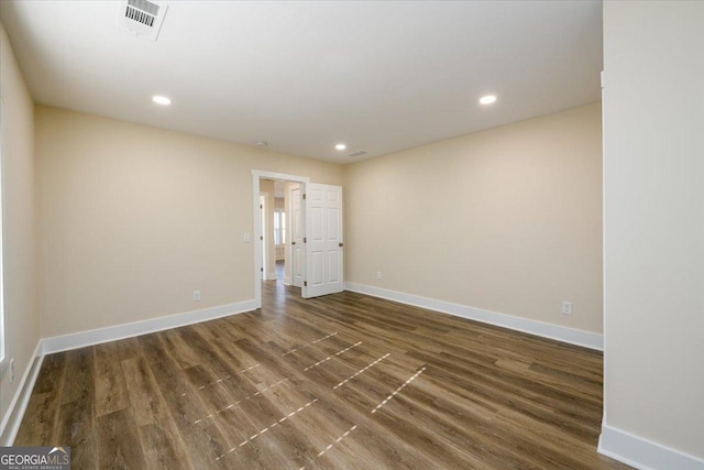 empty room featuring dark hardwood / wood-style floors