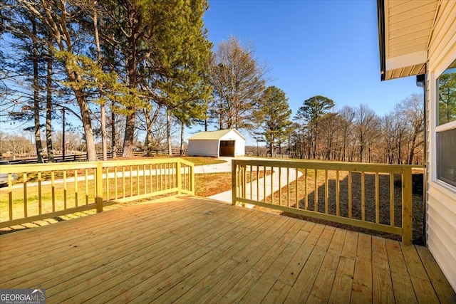 deck featuring a storage shed and a lawn