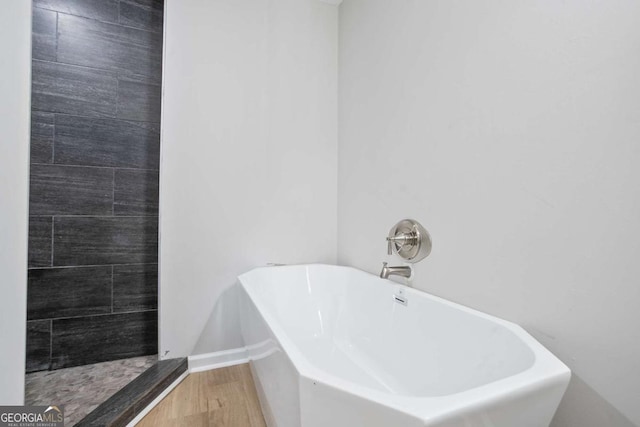 bathroom with hardwood / wood-style flooring