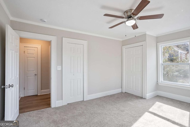 unfurnished bedroom with ceiling fan, ornamental molding, and light carpet