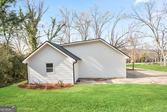 view of home's exterior with a yard