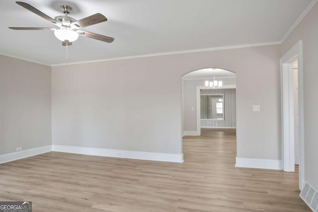 empty room with crown molding, ceiling fan with notable chandelier, and light wood-type flooring