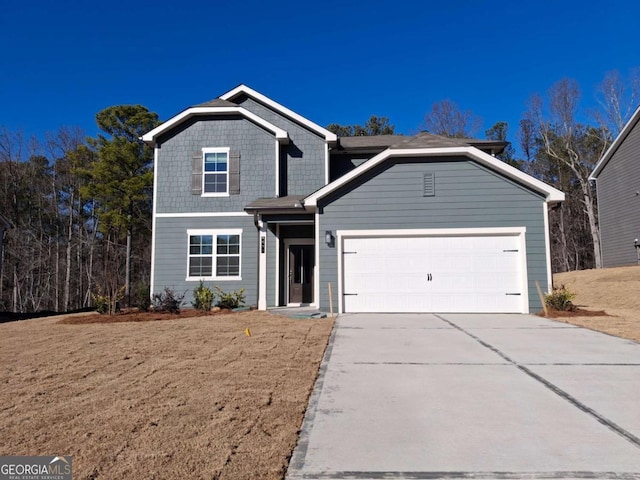 front of property with a garage