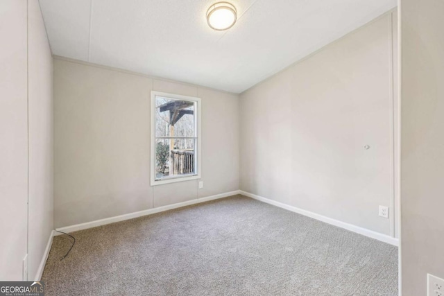 unfurnished room with carpet flooring