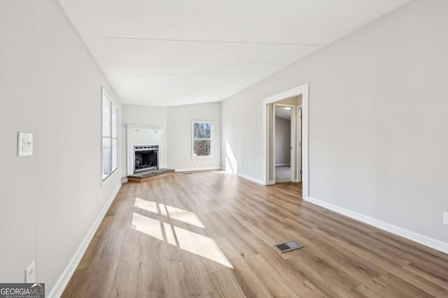 unfurnished living room featuring light hardwood / wood-style flooring