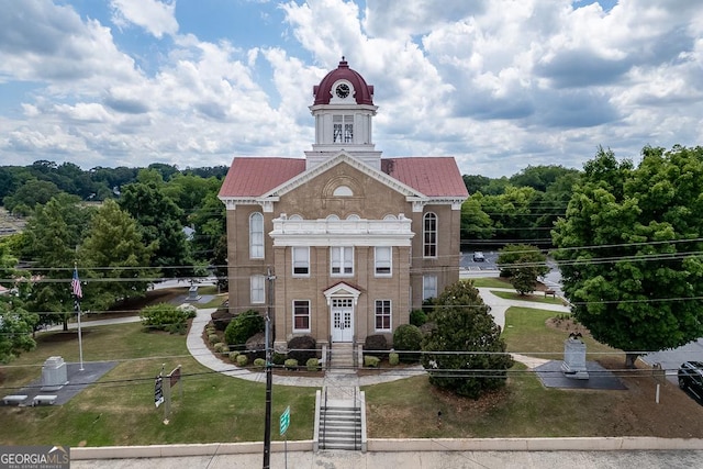 birds eye view of property with a view of trees