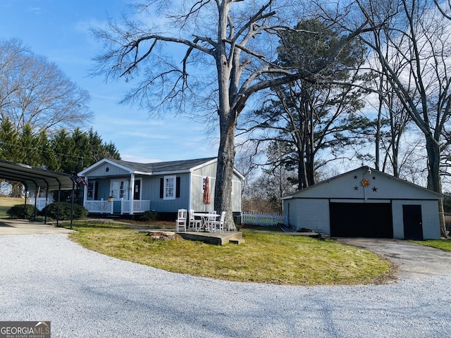 view of property exterior featuring a porch, an outbuilding, a garage, a yard, and a carport