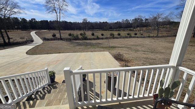 view of yard with a patio area and a rural view