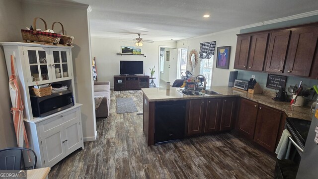 kitchen with dark brown cabinetry, appliances with stainless steel finishes, a peninsula, light countertops, and under cabinet range hood