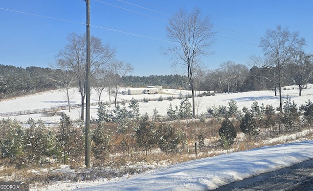 view of yard layered in snow