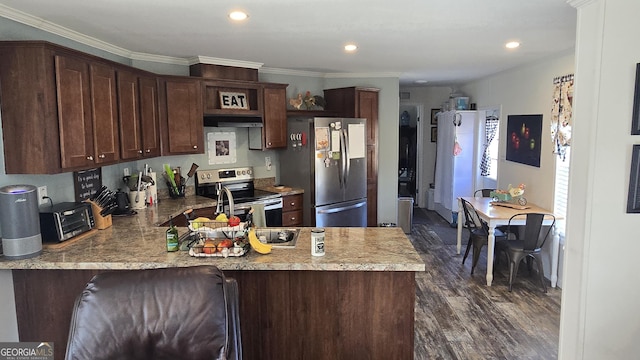 kitchen featuring dark brown cabinetry, stainless steel appliances, range hood, and kitchen peninsula