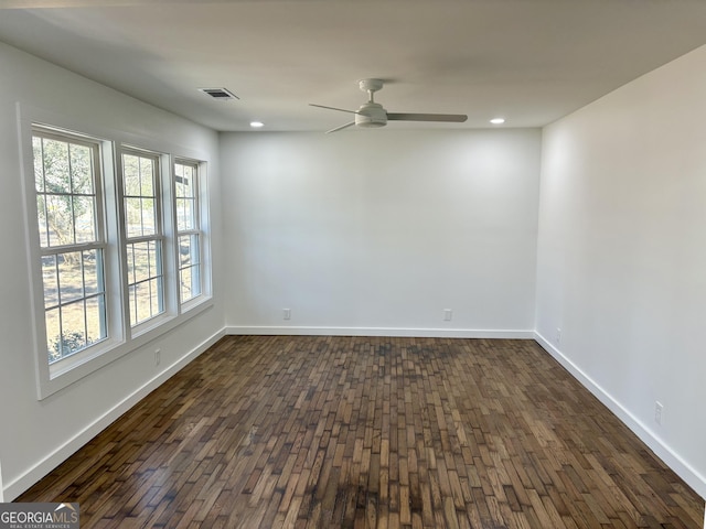 unfurnished room with dark wood-type flooring and ceiling fan