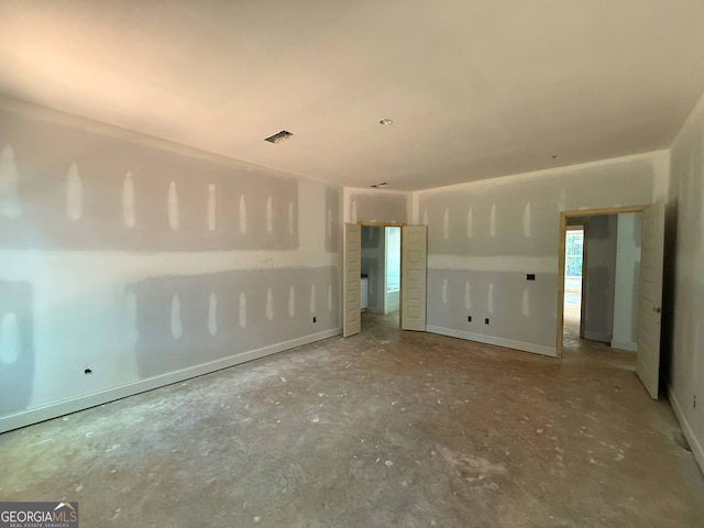 150 Asa Moseley Rd, Mcdonough, GA 30252 - spare room with unfinished concrete floors