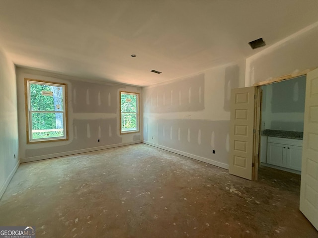 150 Asa Moseley Rd, Mcdonough, GA 30252 - empty room featuring unfinished concrete floors and baseboards
