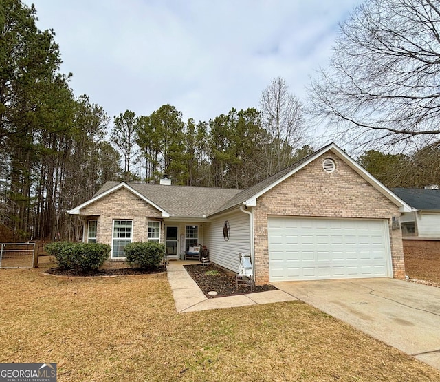 ranch-style home with a garage and a front lawn