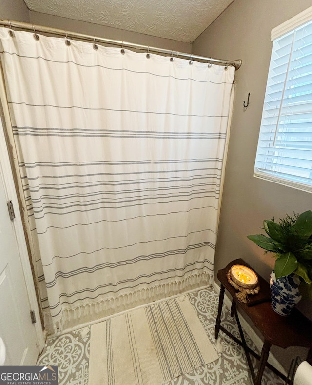 bathroom with a textured ceiling