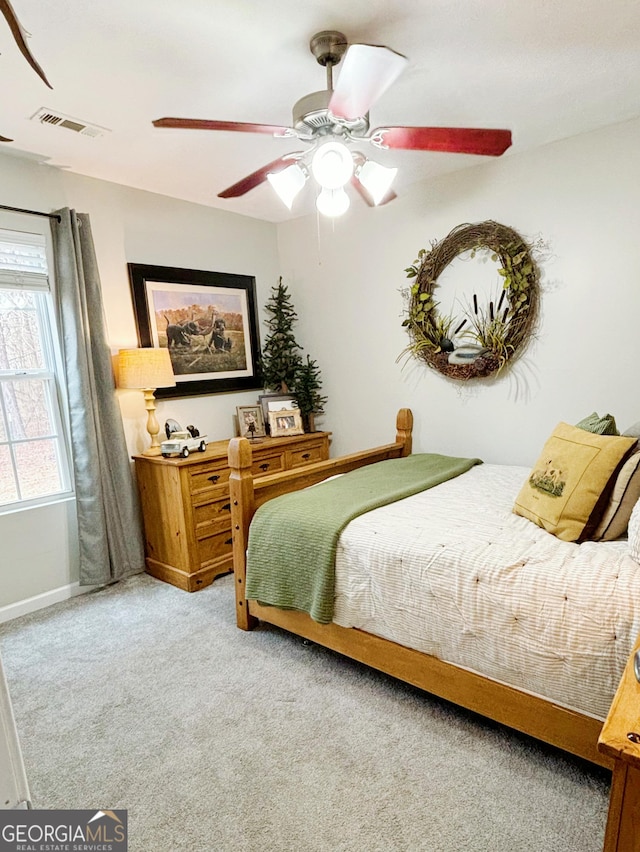 carpeted bedroom featuring ceiling fan