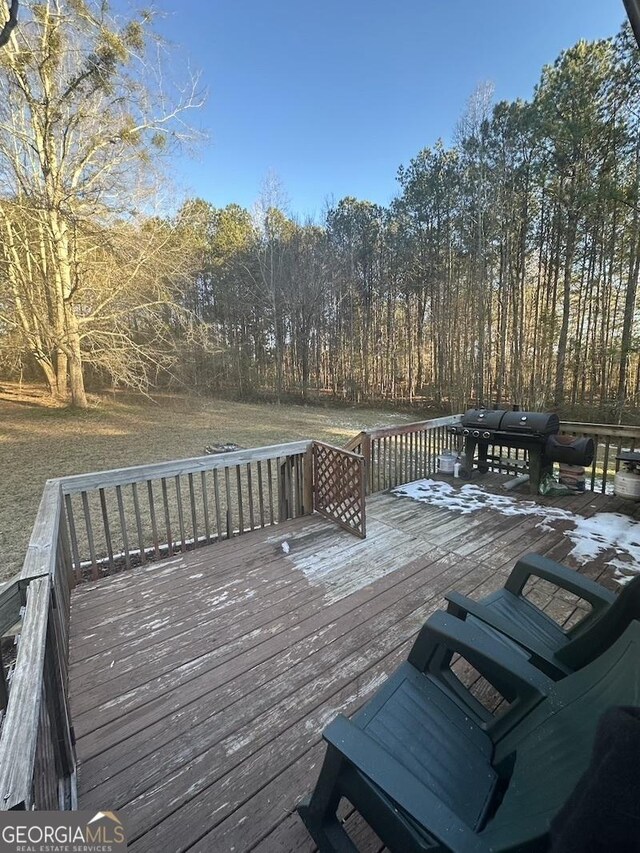 wooden deck featuring grilling area