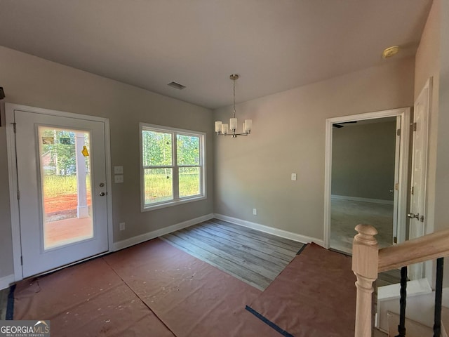 148 Asa Moseley Rd, Mcdonough, GA 30252 - unfurnished dining area featuring a chandelier, baseboards, and wood finished floors