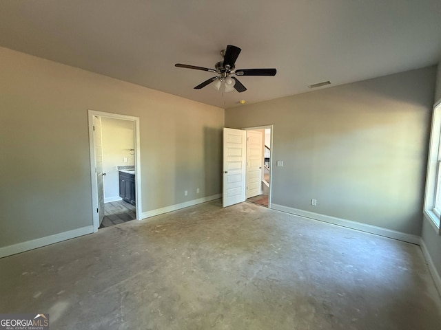 148 Asa Moseley Rd, Mcdonough, GA 30252 - unfurnished bedroom featuring unfinished concrete flooring, baseboards, connected bathroom, and ceiling fan