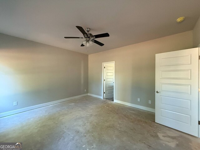 148 Asa Moseley Rd, Mcdonough, GA 30252 - unfurnished bedroom featuring unfinished concrete floors, baseboards, and a ceiling fan