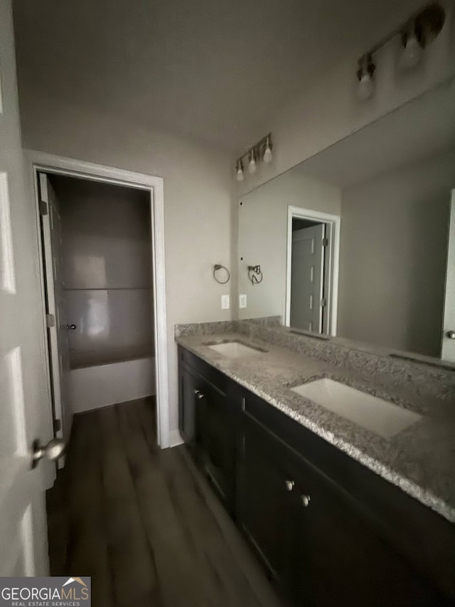 148 Asa Moseley Rd, Mcdonough, GA 30252 - full bath featuring wood finished floors and double vanity