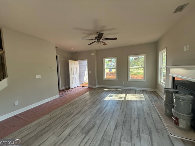 148 Asa Moseley Rd, Mcdonough, GA 30252 - unfurnished living room with ceiling fan, baseboards, and wood finished floors