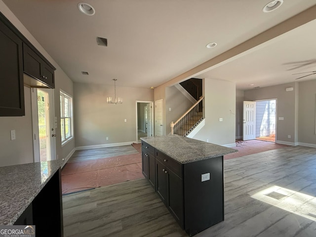 148 Asa Moseley Rd, Mcdonough, GA 30252 - kitchen featuring plenty of natural light, a chandelier, wood finished floors, and recessed lighting