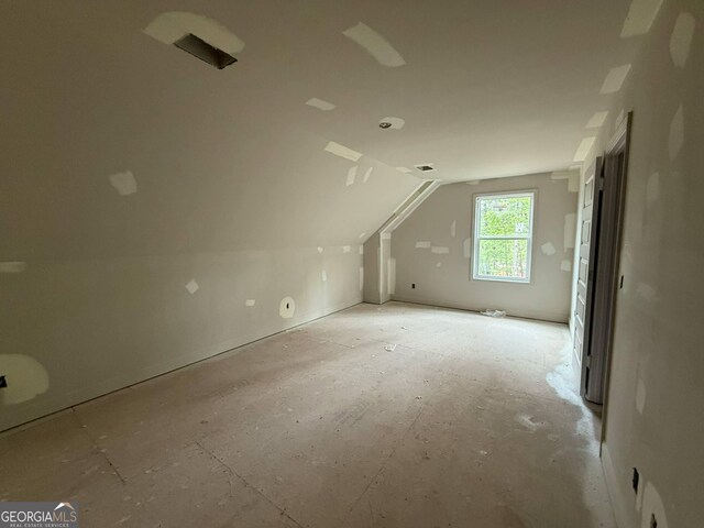 additional living space with vaulted ceiling