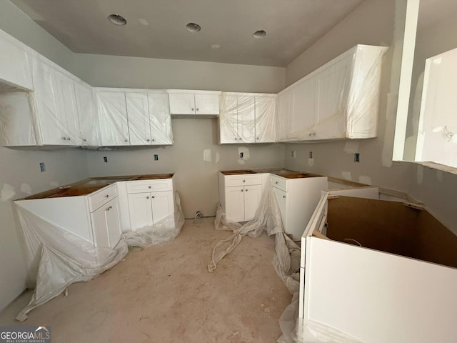 kitchen featuring white cabinetry