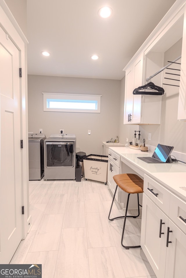 clothes washing area featuring washer and clothes dryer