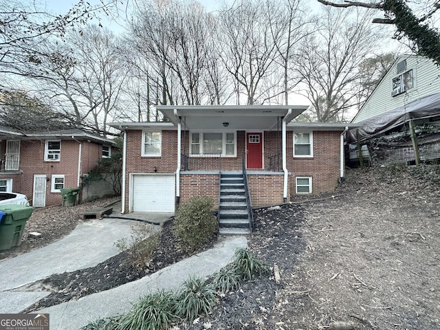 view of front of home featuring a garage and covered porch