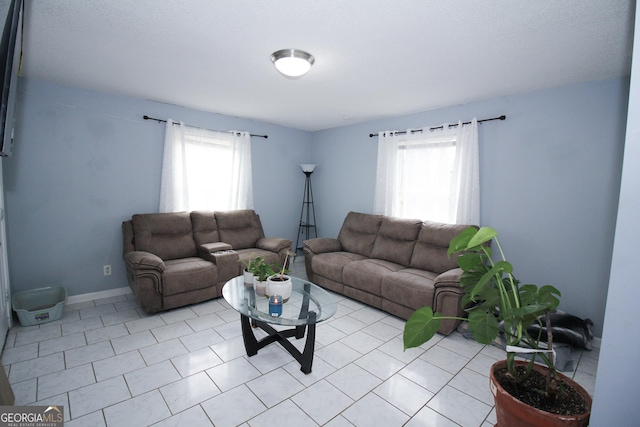 tiled living room with a healthy amount of sunlight