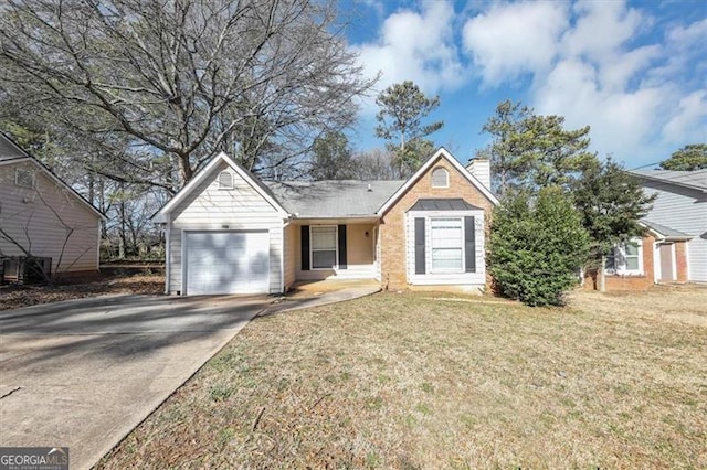 view of front of property featuring a garage and a front yard