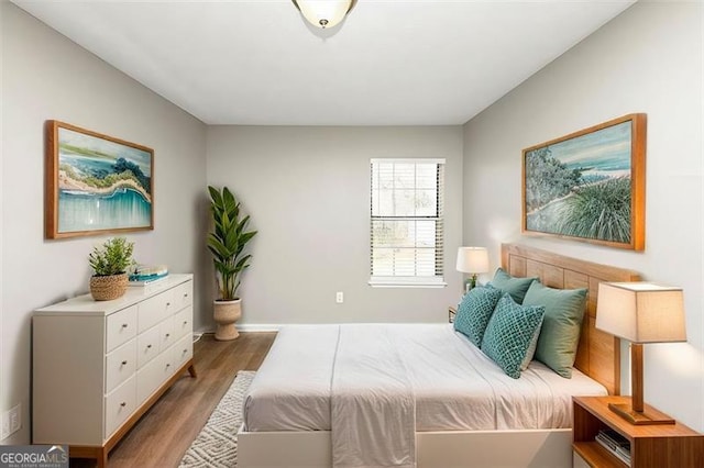 bedroom with hardwood / wood-style flooring