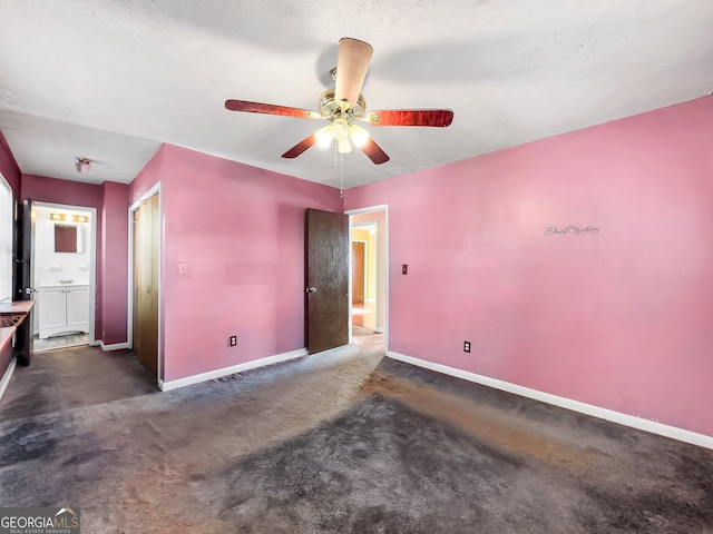 empty room featuring ceiling fan and a textured ceiling