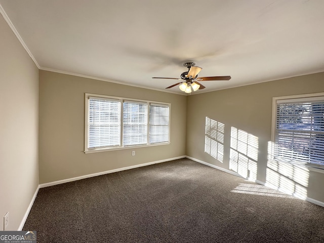 spare room with crown molding, ceiling fan, and carpet