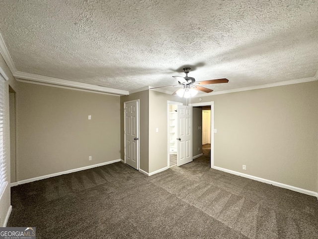 unfurnished bedroom featuring a textured ceiling, ornamental molding, ceiling fan, and dark colored carpet