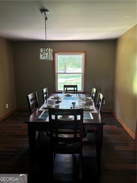 dining room with dark hardwood / wood-style flooring