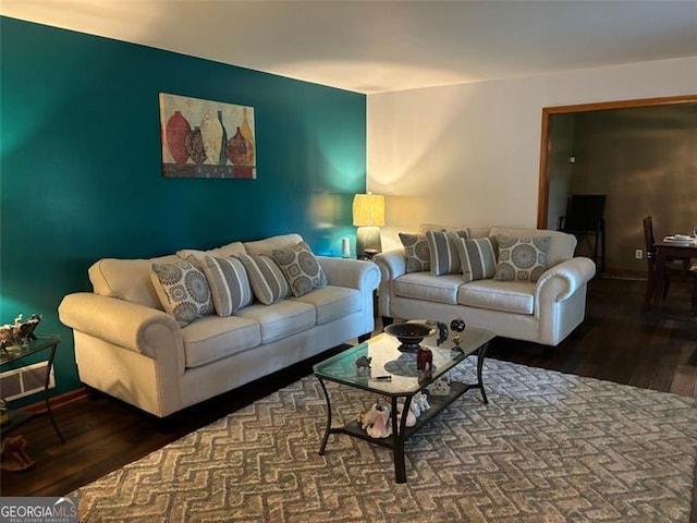 living room featuring dark wood-type flooring